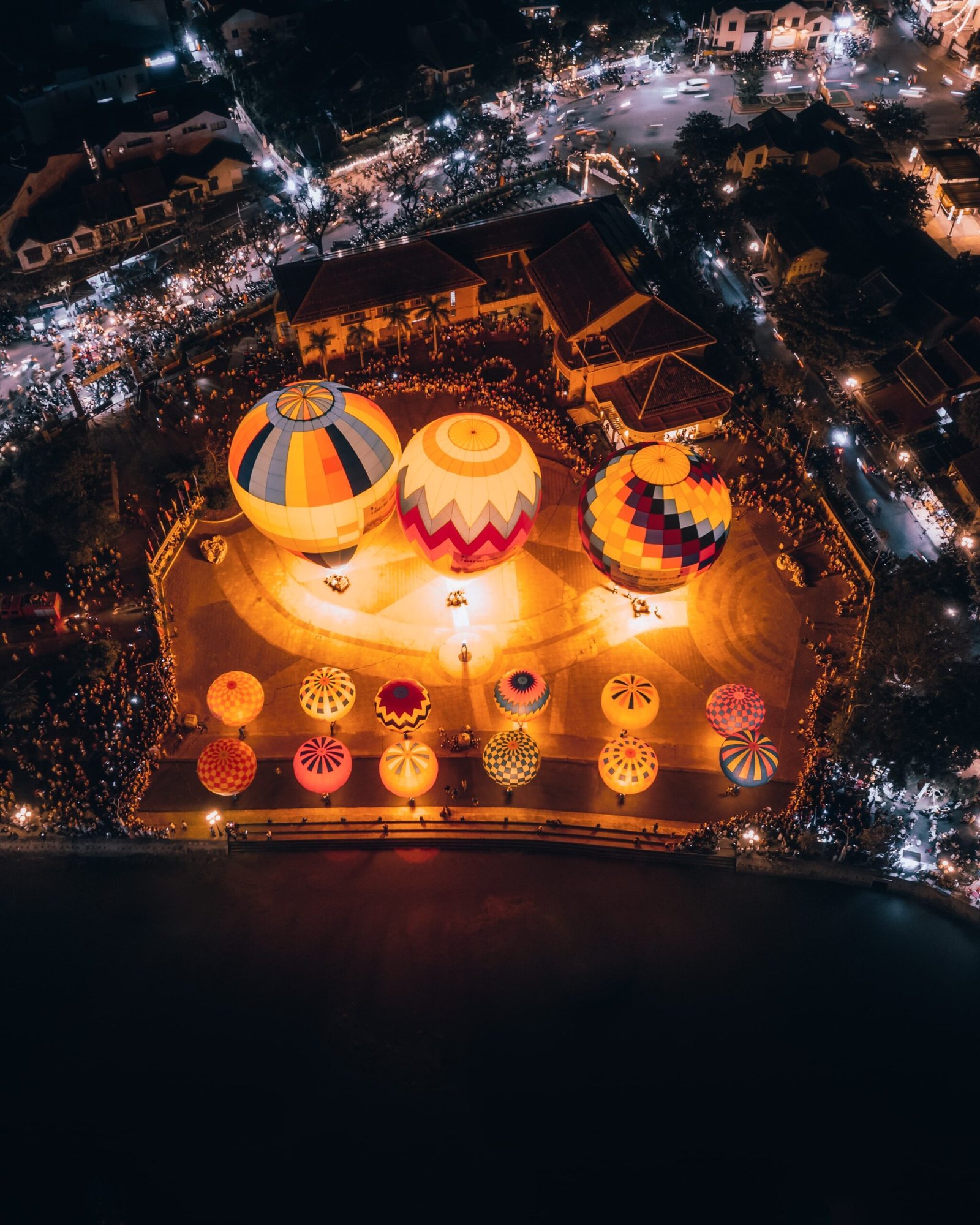Night drone shot of hot air balloons in Hoi An, Vietnam