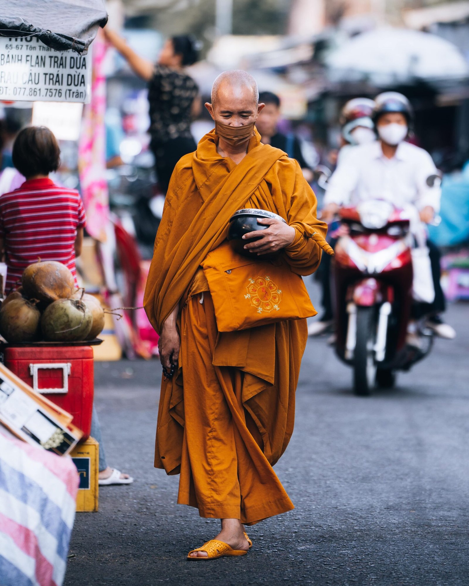 Photo of a monk walking in Ho Chi Minh City